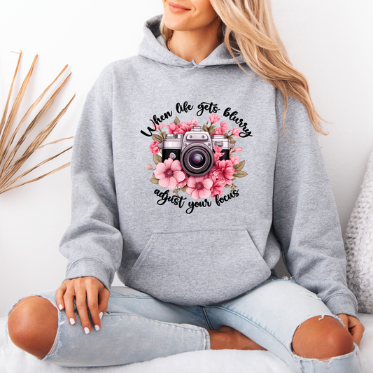 “Adjust Your Focus 📸🌸 | Floral Camera-Inspired Hoodie”